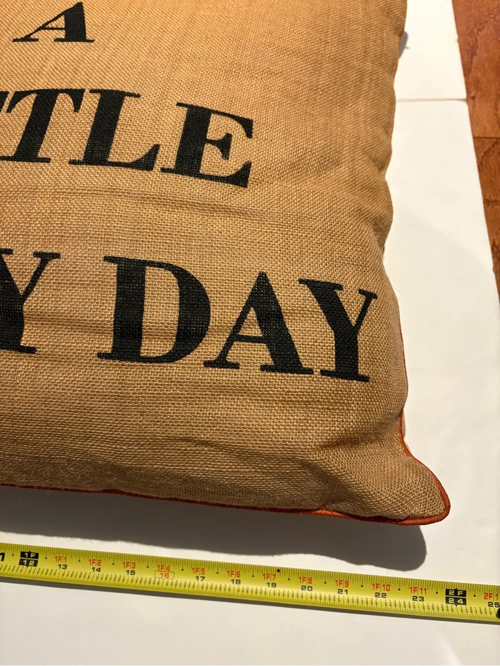 Laugh A Little Every Day Burlap Accent Pillow - Tan with Black Letters.